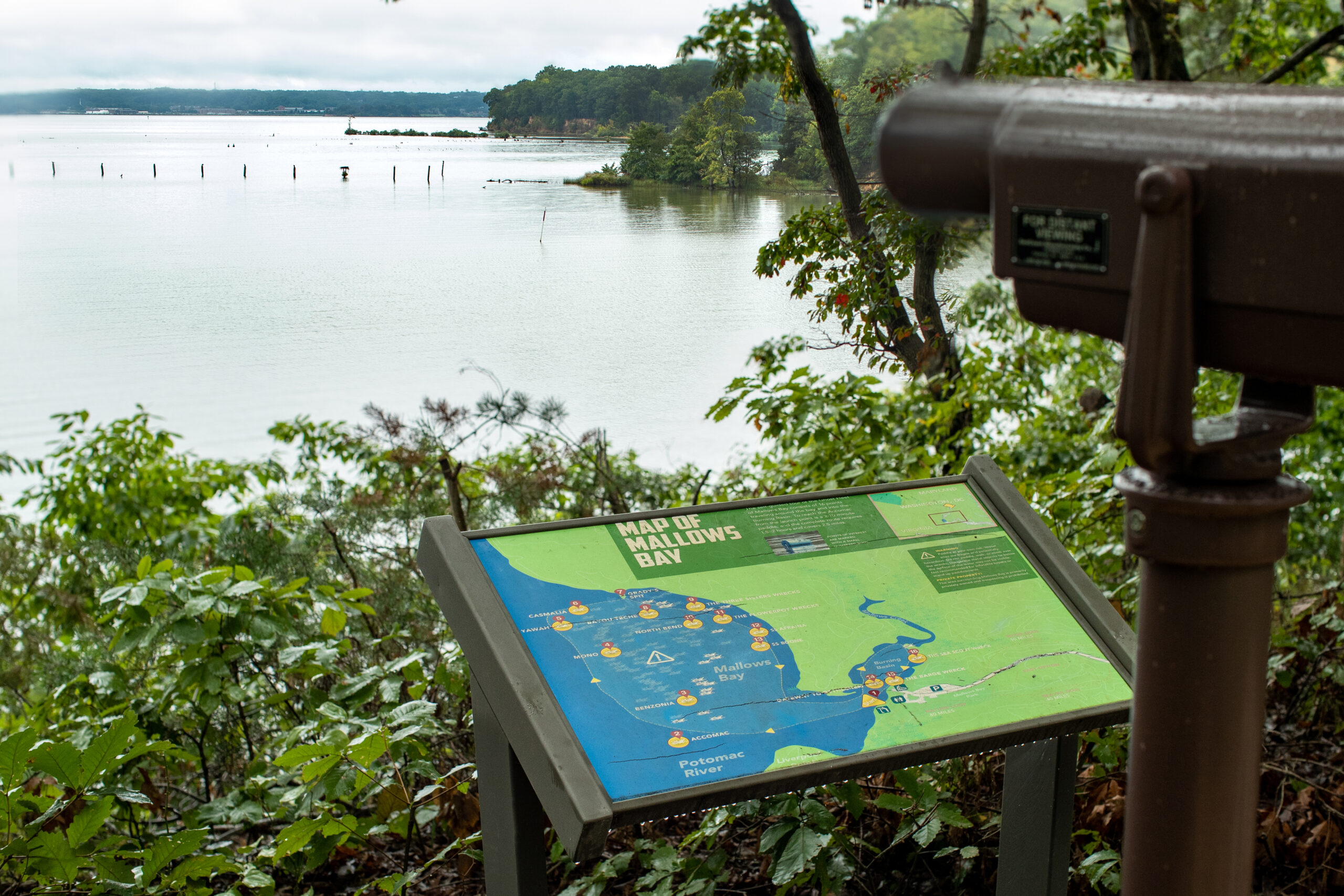 A telescope and map of Mallows  Bay help you see the Ghost Fleet in greater detail (Matt McIntosh/NOAA).